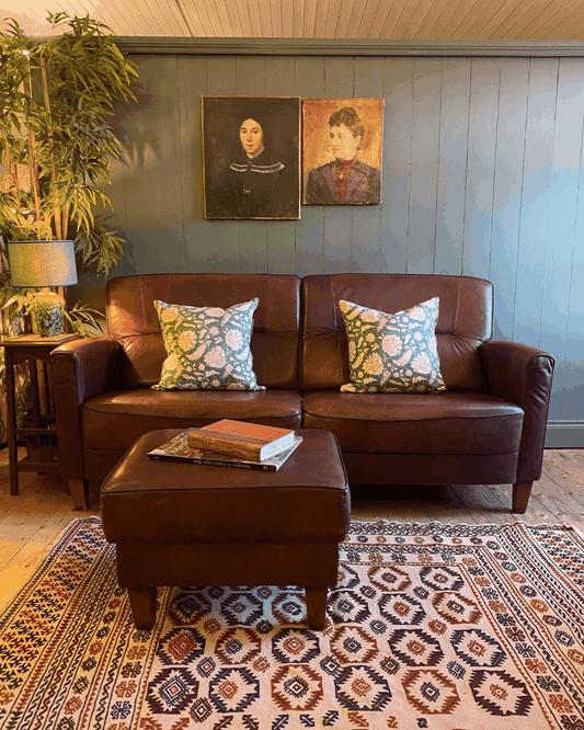 Vintage Leather two-seat sofa and footstool