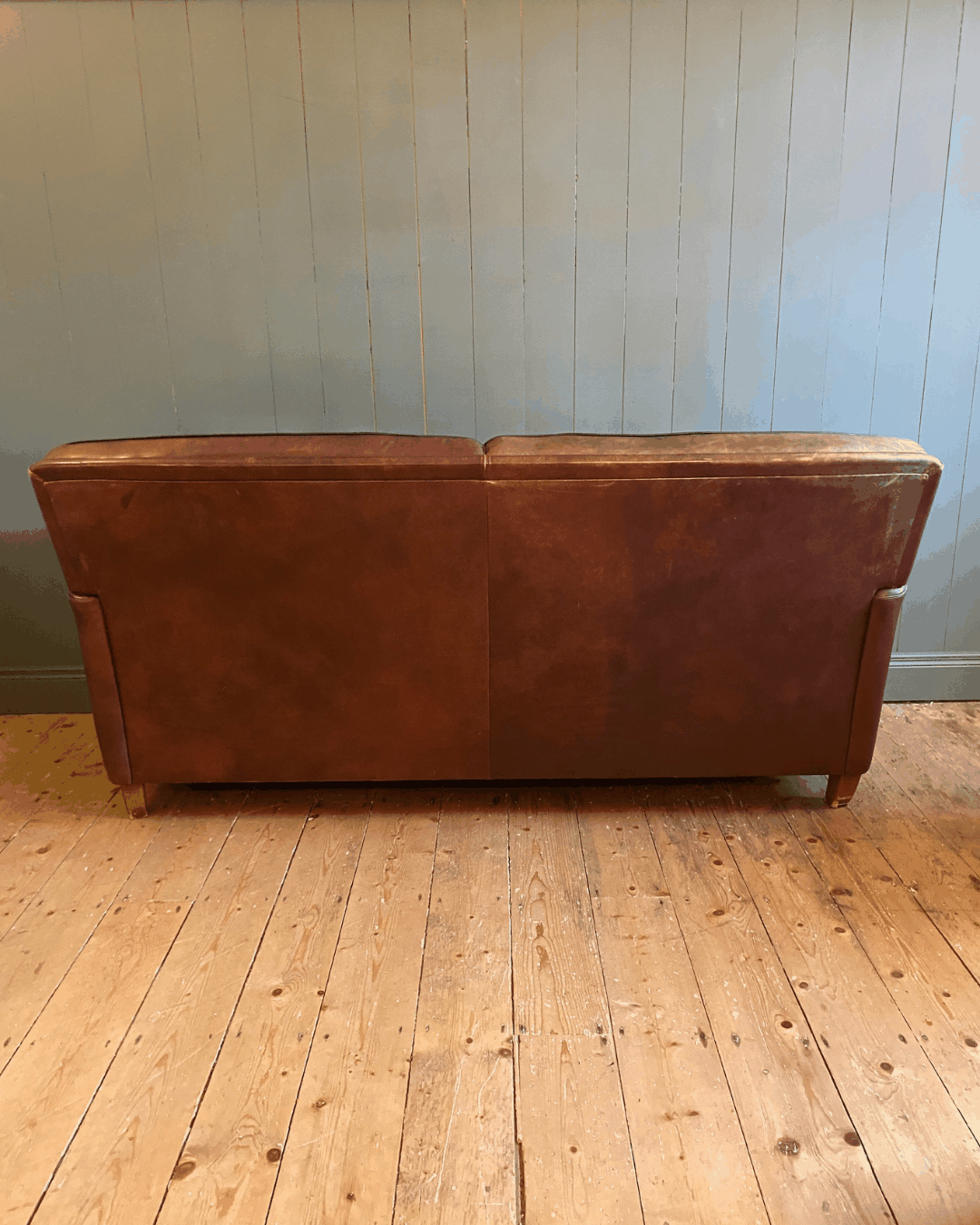 Vintage Leather two-seat sofa and footstool